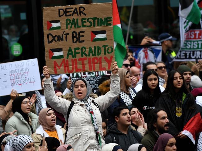 SYDNEY, AUSTRALIA - NewsWire Photos, MAY, 30, 2021: Palestine supporters hold placards during a rally at Town Hall in Sydney. Picture: NCA NewsWire/Bianca De Marchi