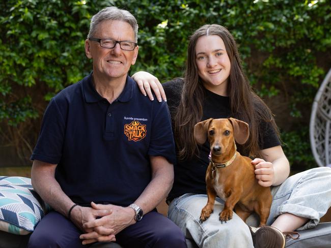 Wayne Holdsworth and daughter Daisy, 15, with Shandy the dog, at home in Melbourne. Picture: Jason Edwards