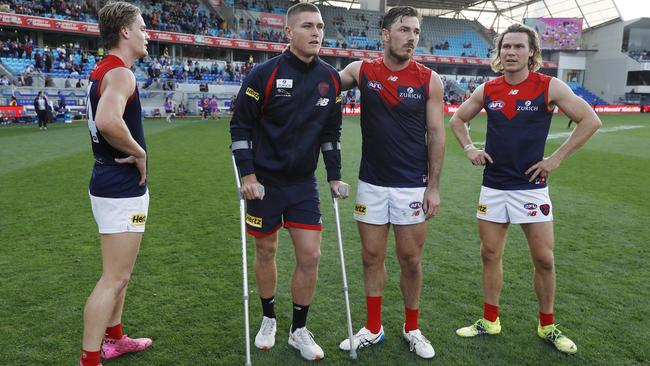 Adam Tomlinson injured his knee in Melbourne’s clash with North Melbourne at Hobart in Round 7. Picture: Getty Images