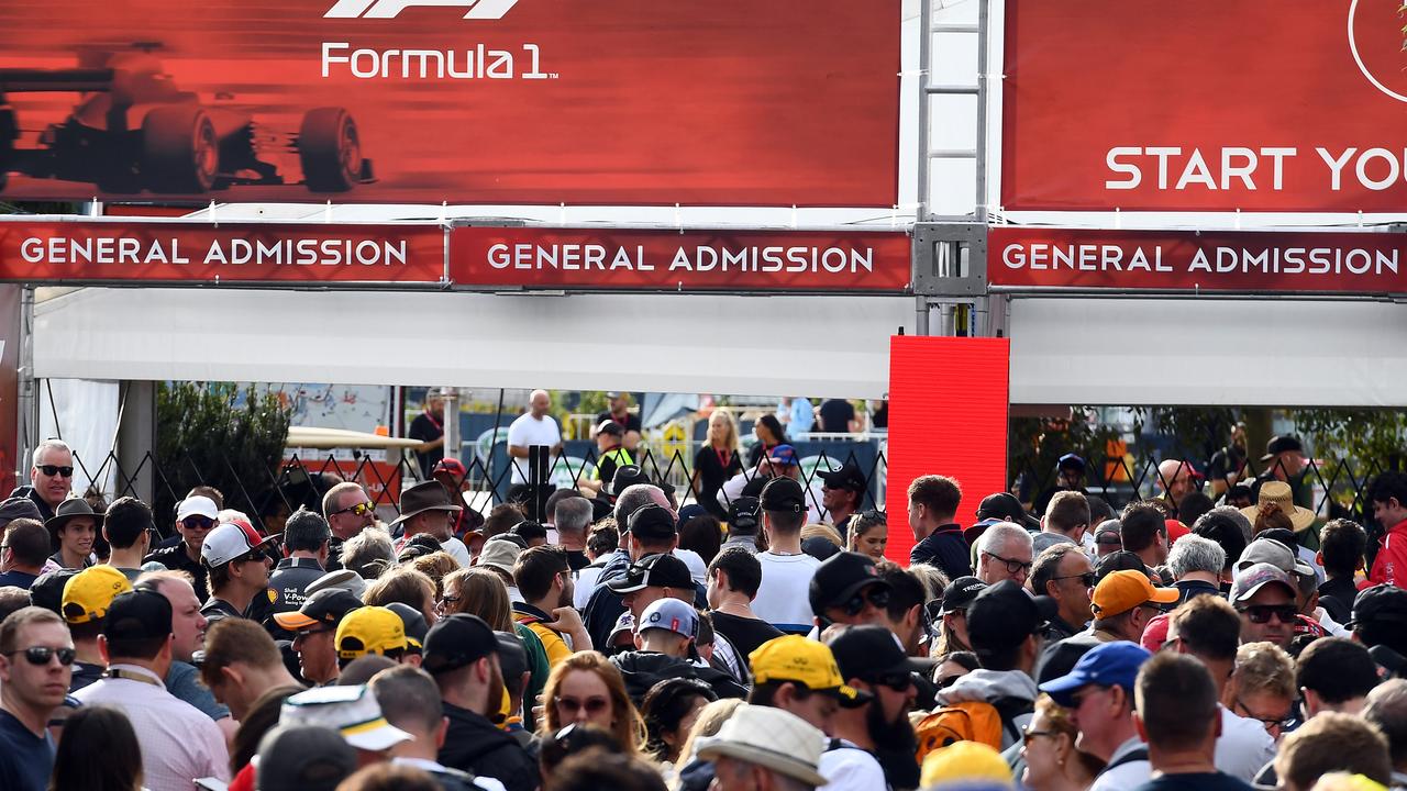 Fans queue up outside the gates prior to the Grand Prix’s cancellation.