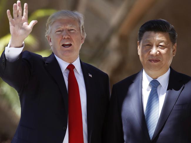 Donald Trump, left, and Chinese President Xi Jinping spoke on Monday about North Korea. Picture: AP