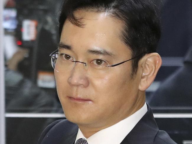 FILE - In this Dec, 6, 2016 file photo, Lee Jae-yong, a vice chairman of Samsung Electronics Co. arrives for hearing at the National Assembly in Seoul, South Korea. The special prosecutors office said Monday, Jan. 16, 2017 that it requested an arrest warrant for Lee, the 48-year-old Samsung Electronics vice chairman as a bribery suspect in the influence-peddling scandal that led to the impeachment of South Korea's president. (AP Photo/Lee Jin-man, File)