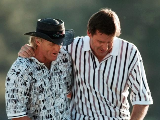 FILE - In this April 14, 1996, file photo, England's Nick Faldo, right, and Australia's Greg Norman walk off the 18th hole after Faldo won his third Masters golf tournament at the Augusta National Golf Club in Augusta, Ga. Norman, who has won every major but the Masters, is most famous for his collapse in 1996, the year he tied the course record with a 63 in the opening round but could not hold hold off Faldo when it counted on Sunday. (AP Photo/Dave Martin, File) Picture: Ap