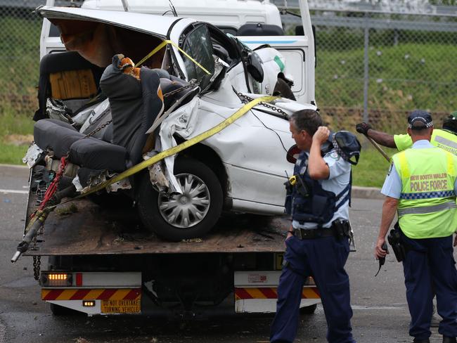 Pictured on Shedworth st Marayong is the mangled wreck on the back of a tow truck at the scene of a car crash which has left three women dead and two others seriously injured after their car rolled at high speed during a police pursuit.