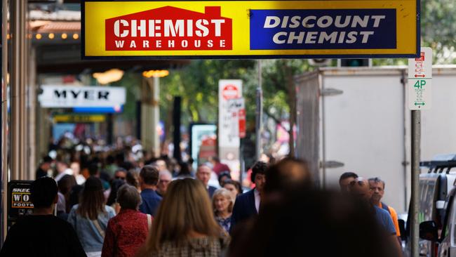 SYDNEY, AUSTRALIA - NewsWire Photos, October 29 2024. GENERIC. Inflation. Shopping. Retail. Economy. Cost of living crisis. Crowded footpath beneath a Chemist Warehouse sign. Picture: NewsWire / Max Mason-Hubers