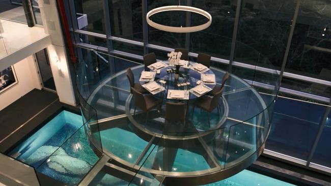 The circular glass dining room, suspended three metres above the 60 metre pool, is “king of ready for takeoff”.