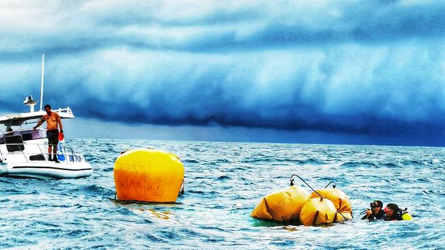 The group prepare to retrieve the sunken Madfish from the bottom of the ocean. Picture: Chace Karpenko