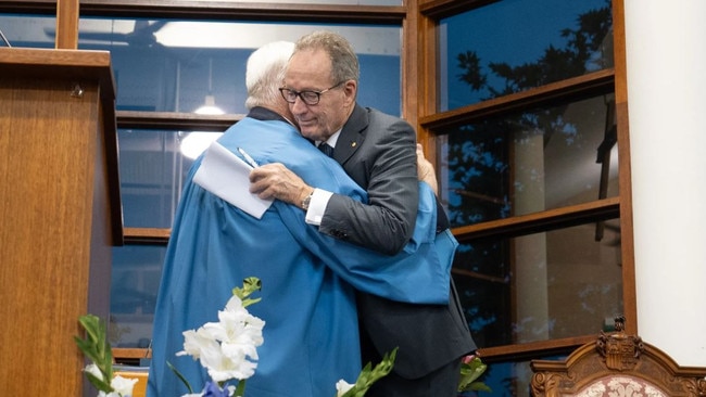 Somerset College Chairman Tony Hickey embraces outgoing headmaster Craig Bassingthwaighte