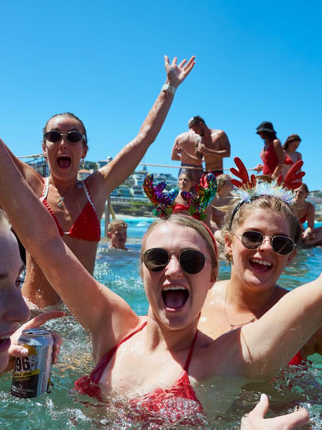 Many of the beachgoers are dressed in festive attire on Christmas Day 2024. Picture: NewsWire / Flavio Brancaleone