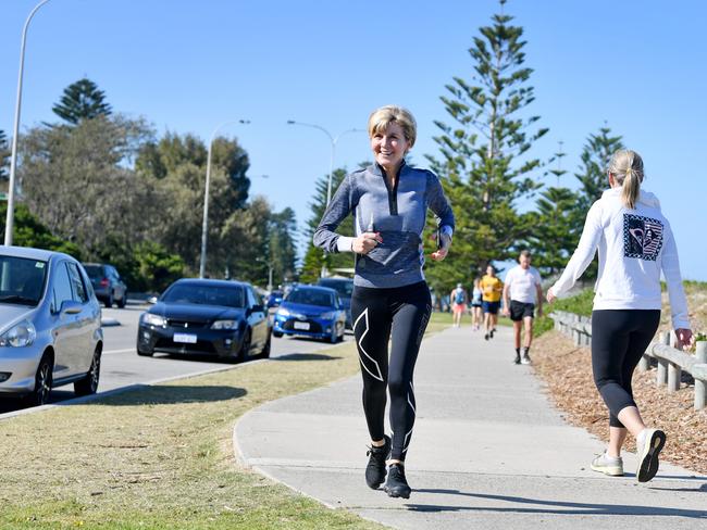 A chipper Julie Bishop goes for a run at Perth’s Cottesloe Beach this morning. Picture: Ian Munro