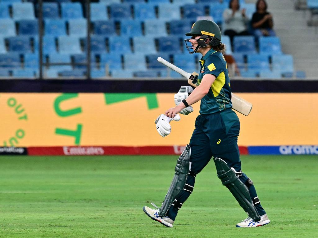 Australia's Georgia Wareham walks back to the pavilion after her dismissal. (Photo by Giuseppe CACACE / AFP)