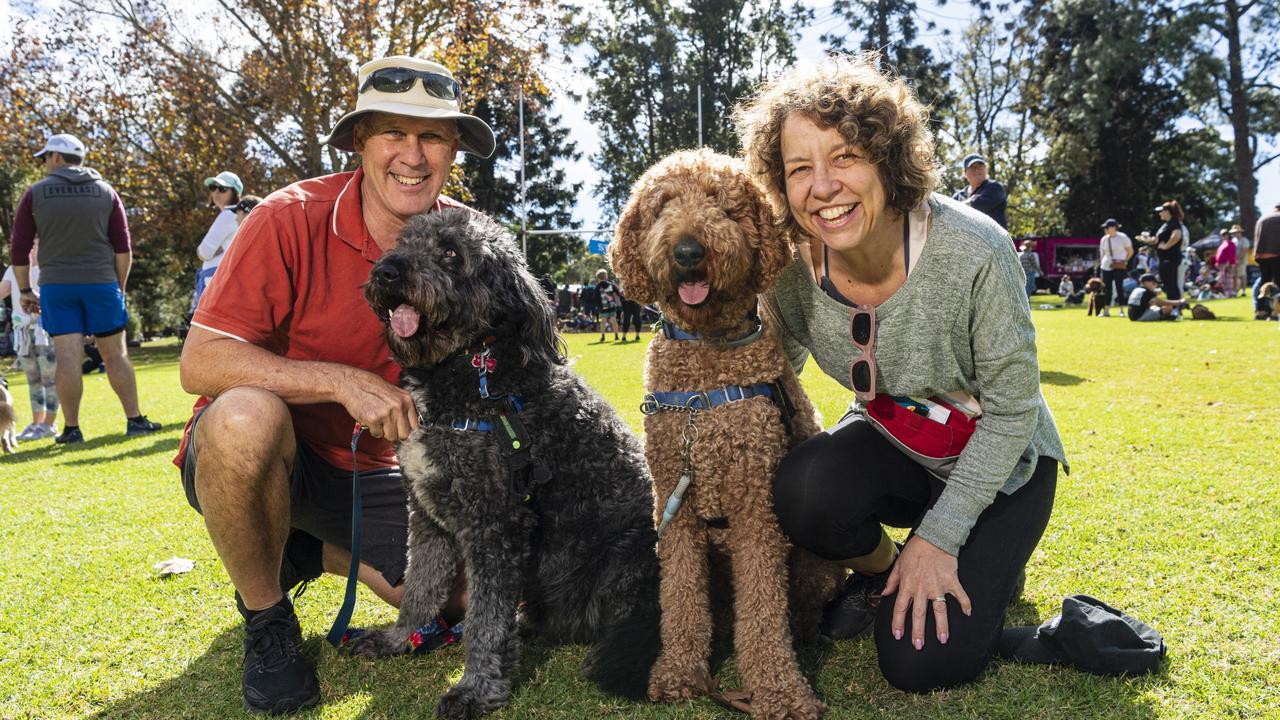 Andrew Tennent with bordoodle Winston and Lisa Hudson with groodle Humphrey at Toowoomba's Million Paws Walk at Queens Park, Friday, May 24, 2024. Picture: Kevin Farmer