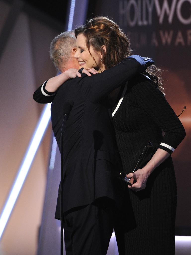 Geena Davis, right, presents the Hollywood career achievement award to Michael Keaton at the Hollywood Film Awards at the Palladium on Friday, Nov. 14, 2014, in Los Angeles. Picture: AFP