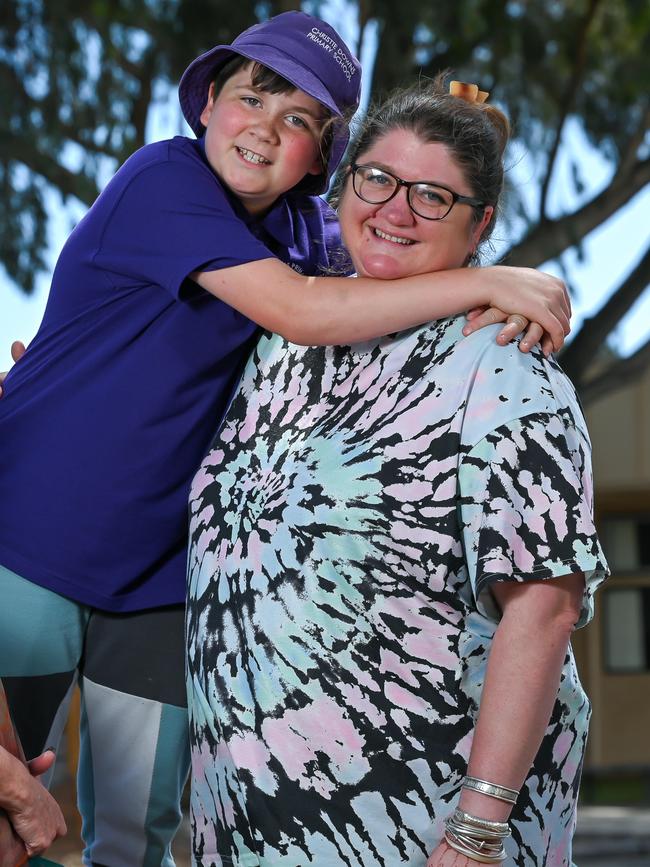 Mum Alicia with son Theo, 10, at Christie Downs Primary School. Picture: Naomi Jellicoe