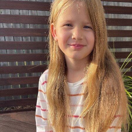 Eight-year old Cooloola Christian College student Hannah Raines has been growing her hair for three years in preparation for the day she will cut it all off for charity. Picture: Stevie Raines