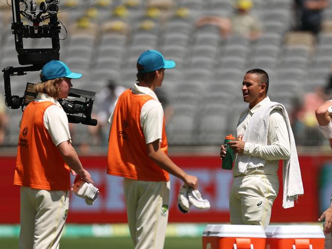 PERTH, AUSTRALIA - NOVEMBER 30: Usman Khawaja of Australia is interviewed via the Flying Fox camera during the drinks break on day one of the First Test match between Australia and the West Indies at Optus Stadium on November 30, 2022 in Perth, Australia. (Photo by Cameron Spencer/Getty Images)