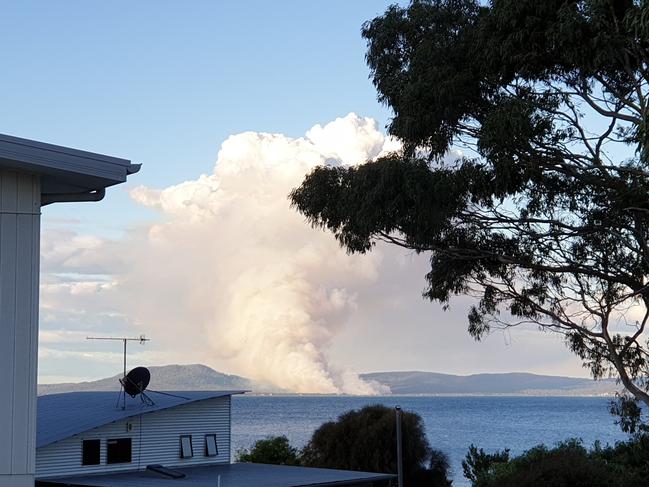 A plume of smoke from a bushfire at Dolphin Sands viewed from Swansea. Picture: FRANCINE TARGETT