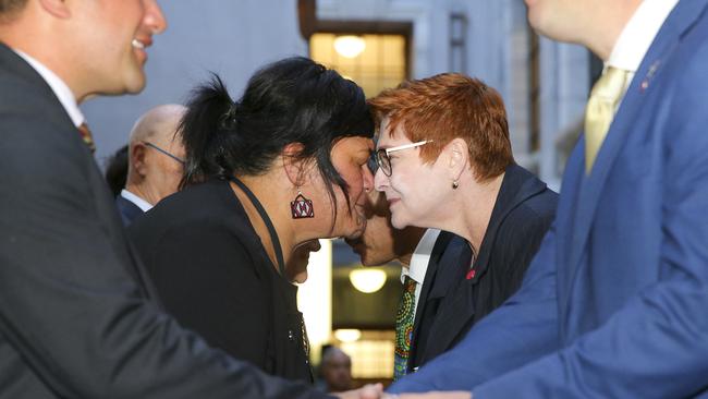 Face off: Marise Payne gets a hongi from her NZ counterpart, Nanaia Mahuta. Picture: Getty Images