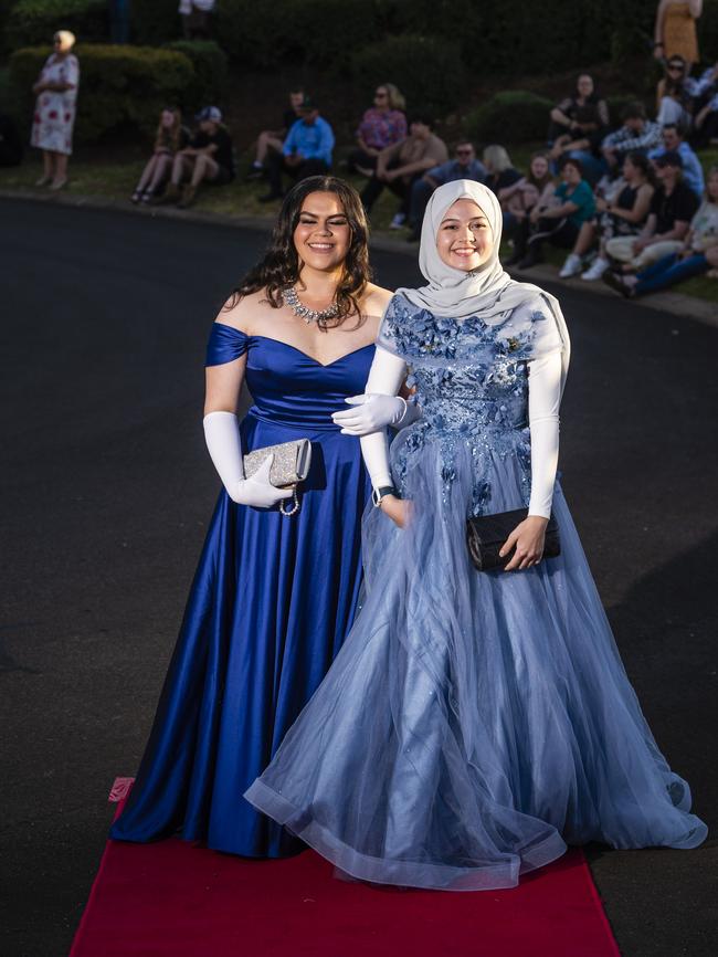 Izabella Gibson (left) and Anisa Anderson arrive at Harristown State High School formal at Highfields Cultural Centre, Friday, November 18, 2022. Picture: Kevin Farmer