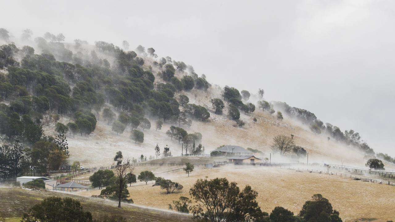 Properties at Long Flat south of Gympie resemble snowfields after a super cell dumped hail, tore down trees and caused devastation across the Burnett and South East. Photo Lachie Millard