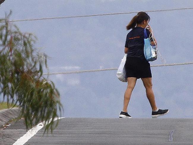 Pedestrians walk in the road on Coolibah street in Southport. Picture: Tertius Pickard