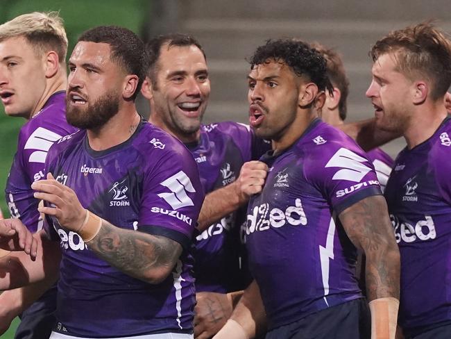 Josh Addo-Carr of the Storm reacts with Cameron Smith of the Melbourne Storm and Cameron Munster of the Storm after scoring a try during the Round 4 NRL match between Melbourne Storm and the South Sydney Rabbitohs at AAMI Park in Melbourne, Friday, June 5, 2020. (AAP Image/Scott Barbour) NO ARCHIVING, EDITORIAL USE ONLY