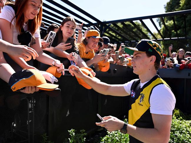 Melbourne’s own Oscar Piastri signs autographs at the Albert Park circuit. Picture: AFP