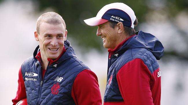 Demons coach Paul Roos will hand over to Simon Goodwin at the end of next year.