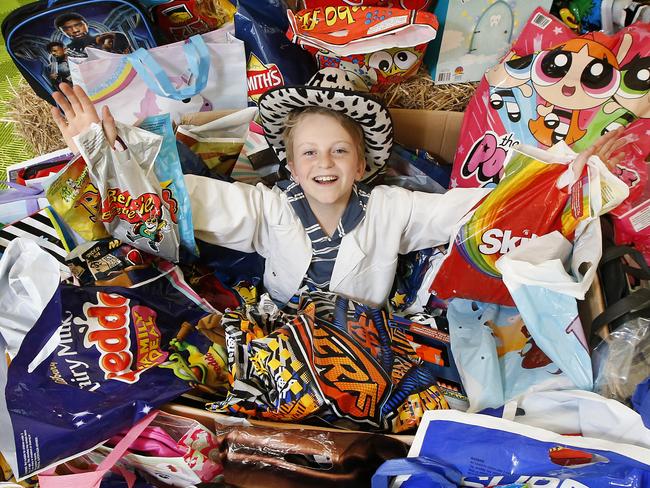 Melbourne Show show bag judging. One of the show bag judges Josh 11, buries himself in his work finding the best show bags on offer.       Picture: David Caird