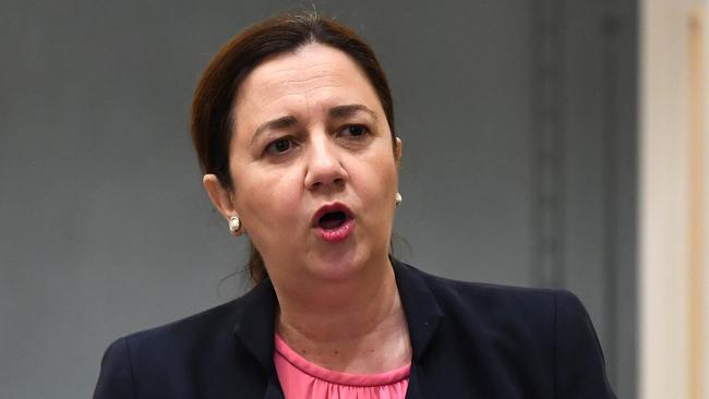 Queensland Premier Annastacia Palaszczuk addresses a reduced chamber, due to social distancing measures, during Question Time at Queensland Parliament in Brisbane, Wednesday, April 22, 2020. Queensland has recorded no new cases of coronavirus in the past 24 hours. (AAP Image/Dan Peled)