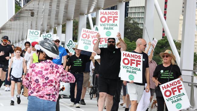 Crowds at the opening of the Kangaroo Point Bridge in Brisbane where some took the opportunity to protest using Victoria Park for an Olympic venue. Picture Lachie Millard