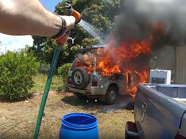 Police officers from Brisbane attached to Operation Whiskey Legion have helped put out a car fire in Tolga. Picture: Queensland Police Service