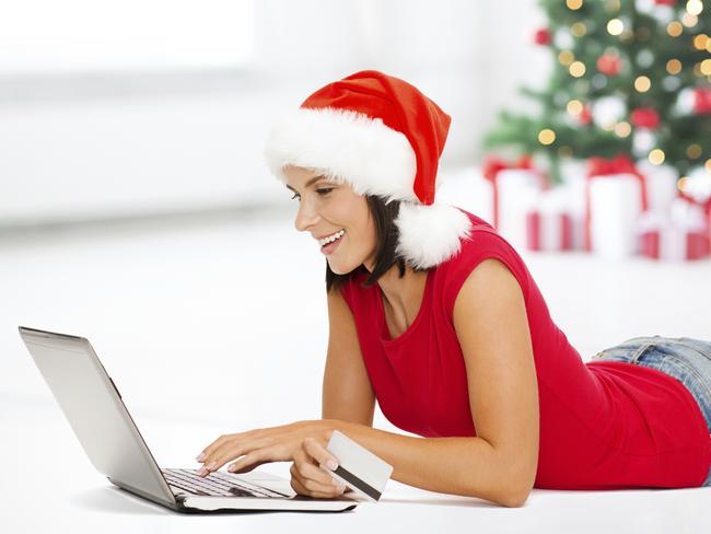 SHOP SMART XMASPicture: istockchristmas, x-mas, online shopping concept - woman in santa helper hat with laptop computer and credit card