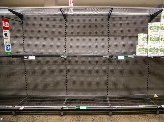 Empty shelves in the toilet paper section at Woolworths in South Melbourne. Picture: Aaron Francis