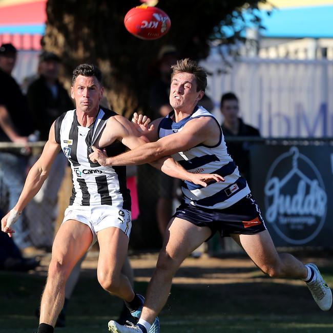 Wangaratta’s Matt Grossman leads his Yarrawonga opponent to the ball. Picture: Yuri Kouzmin