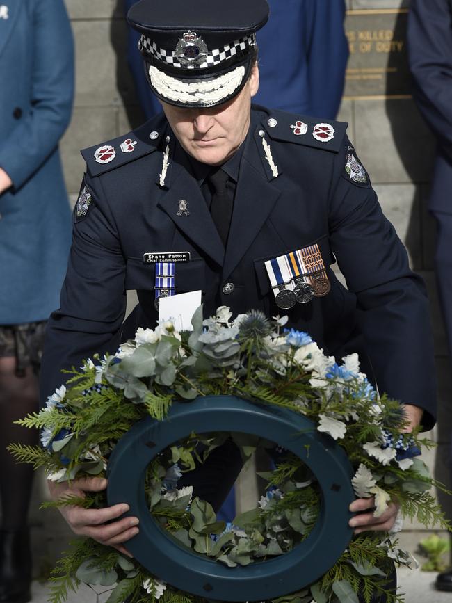 Victoria Police Chief Commissioner Shane Patton lays a wreath.