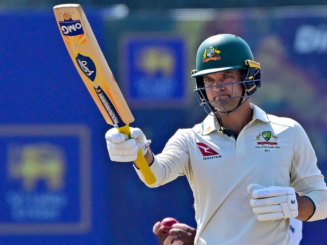 Australia's Alex Carey celebrates after scoring 150 runs during the third day of second test cricket match between Australia and Sri Lanka at the Galle International Cricket Stadium in Galle on February 8, 2025. (Photo by Ishara S. KODIKARA / AFP)