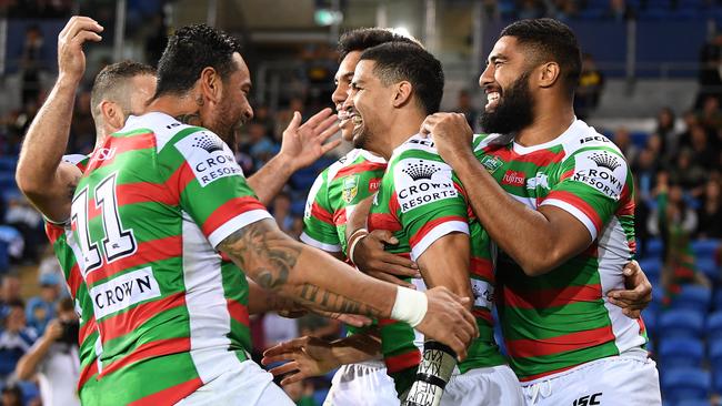 Cody Walker of the Rabbitohs (centre) reacts after scoring a try during the Round 14 NRL match between the Gold Coast Titans and the South Sydney Rabbitohs at CBUS Super Stadium at Robina on the Gold Coast, Friday, June 8, 2018. (AAP Image/Dave Hunt) NO ARCHIVING, EDITORIAL USE ONLY