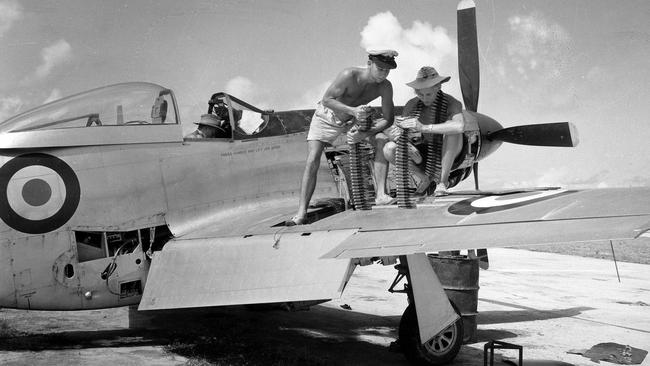 An RAAF crew works on a Mustang at Manus Island airstrip in 1953.