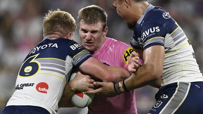 TOWNSVILLE, AUSTRALIA - MAY 10: Luke Garner of the Panthers is tackled during the round 10 NRL match between North Queensland Cowboys and Penrith Panthers at Queensland Country Bank Stadium, on May 10, 2025, in Townsville, Australia. (Photo by Ian Hitchcock/Getty Images)