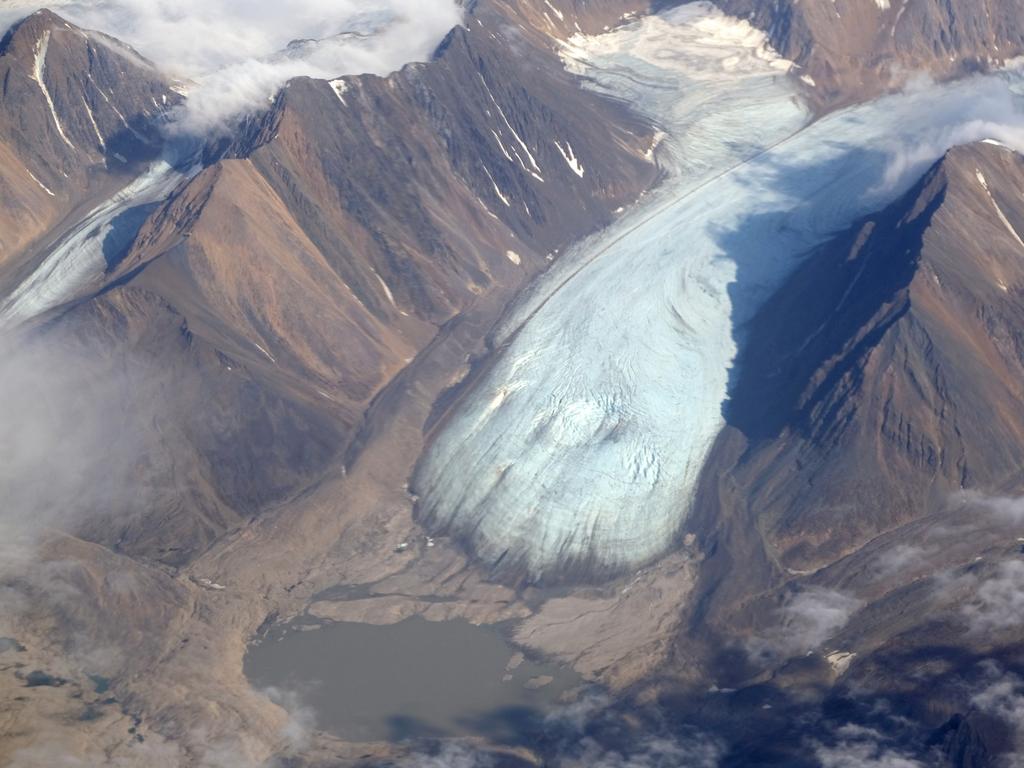 A melting glacier that shows a depression due to meltwater flowing underneath during a summer heatwave on the Svalbard archipelago near Longyearbyen, Norway. Svalbard, located far north of the Arctic Circle, experienced temperatures far above average in 2020, including a new record high on July 25 of 21.7 degrees Celsius. Picture: Sean Gallup/Getty Images