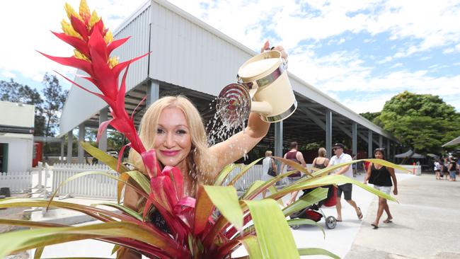 Mia Lee with a plant at Carrara Markets. Picture: Richard Gosling