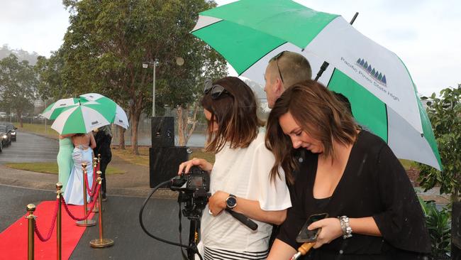 Pacific Pines High formal, at the school. rain on the red carpet. Picture Glenn Hampson