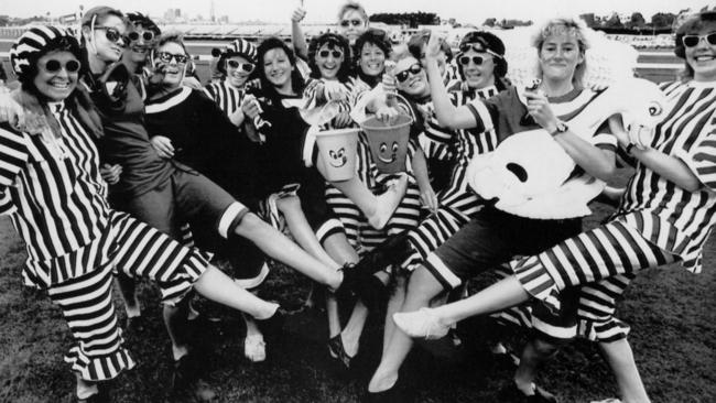 Racegoers dress up in striped outfits in 1987.