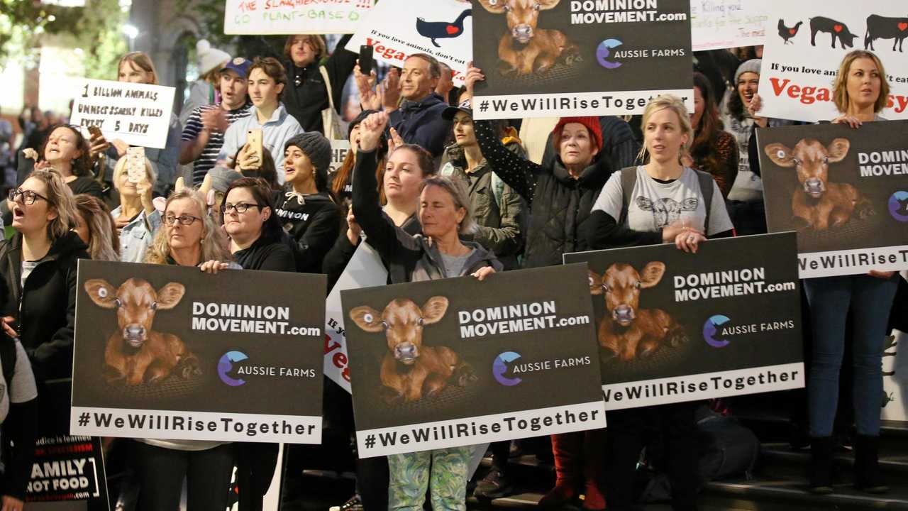 SIGNS OF THE TIMES: Animal rights protesters gather in Melbourne last year. The group Aussie Farms has conflicting views to the agricultural industry. Picture: AAP/DAVID CROSLING