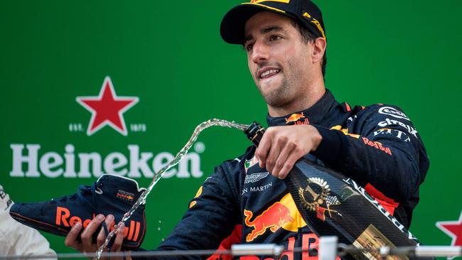 Daniel Ricciardo gets ready to pour champagne into his shoe. Picture: AFP.