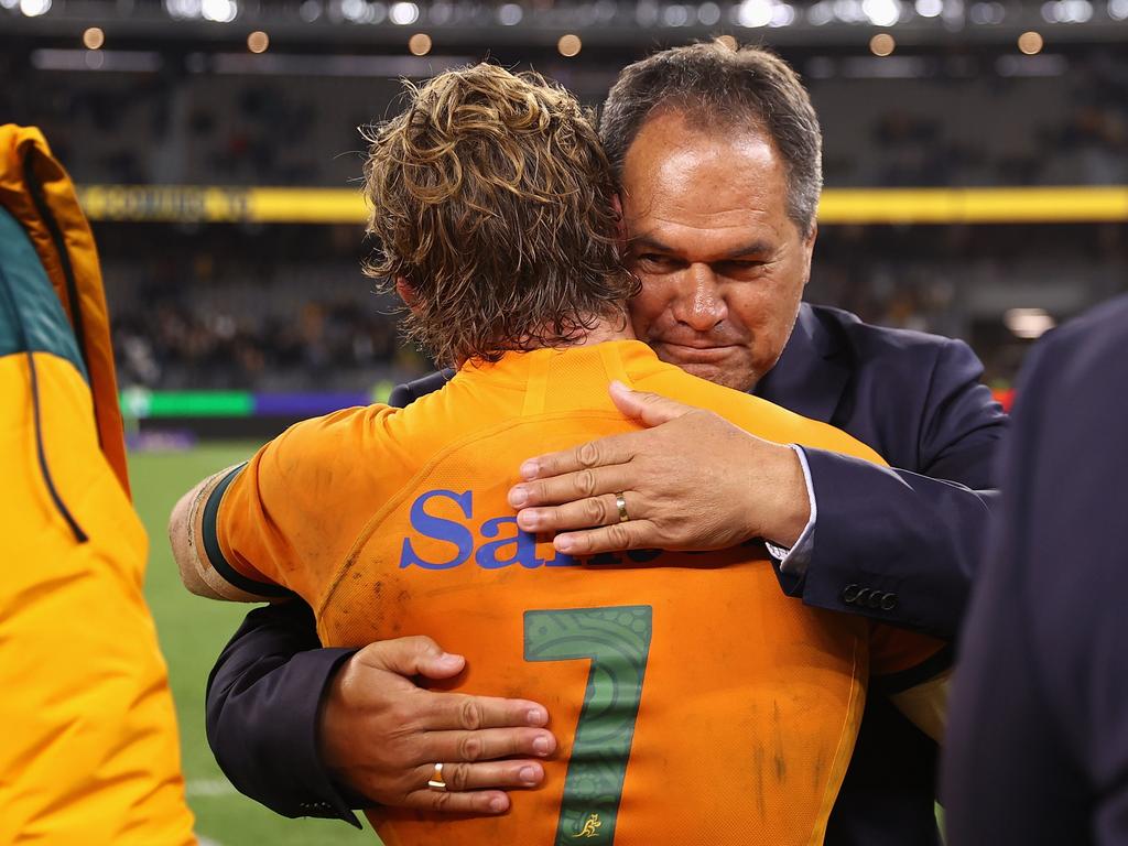 Michael Hooper hugs Dave Rennie after the England win. Picture: Cameron Spencer/Getty