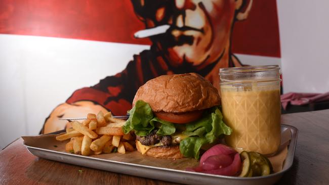 Lester and Earl's cheese burger, where melted cheese is poured all over a burger. Photo: Steve Holland