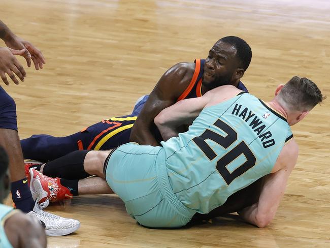 Draymond Green wrestling with Gordon Hayward.