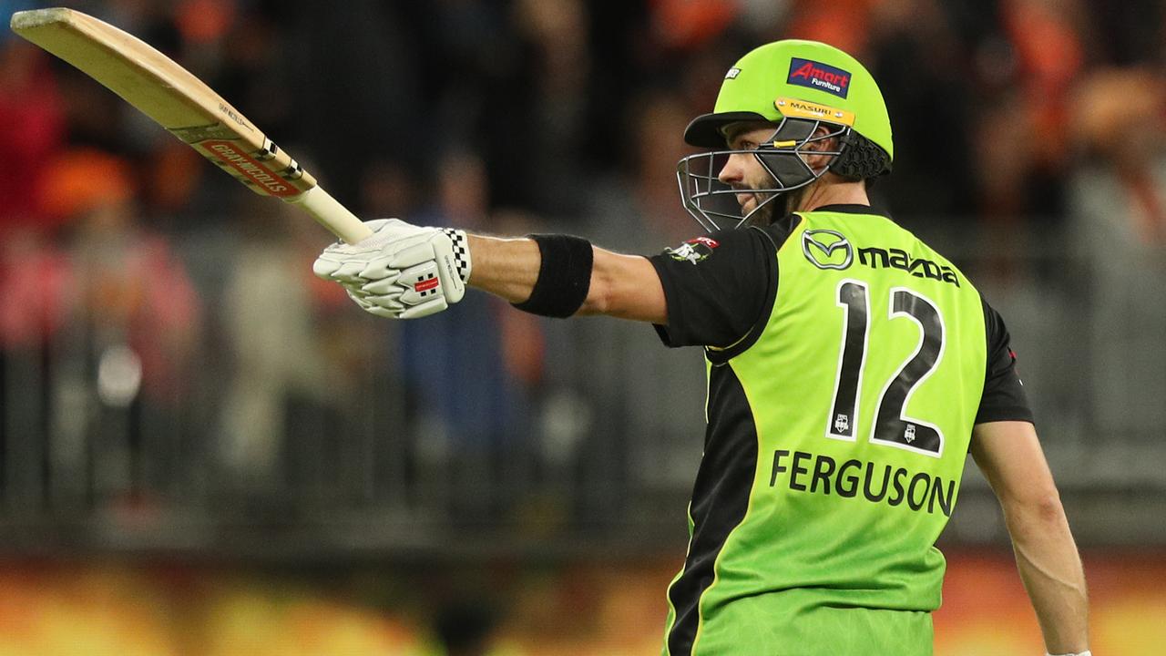 Callum Ferguson of the Thunder raises his bat on reaching a half century.